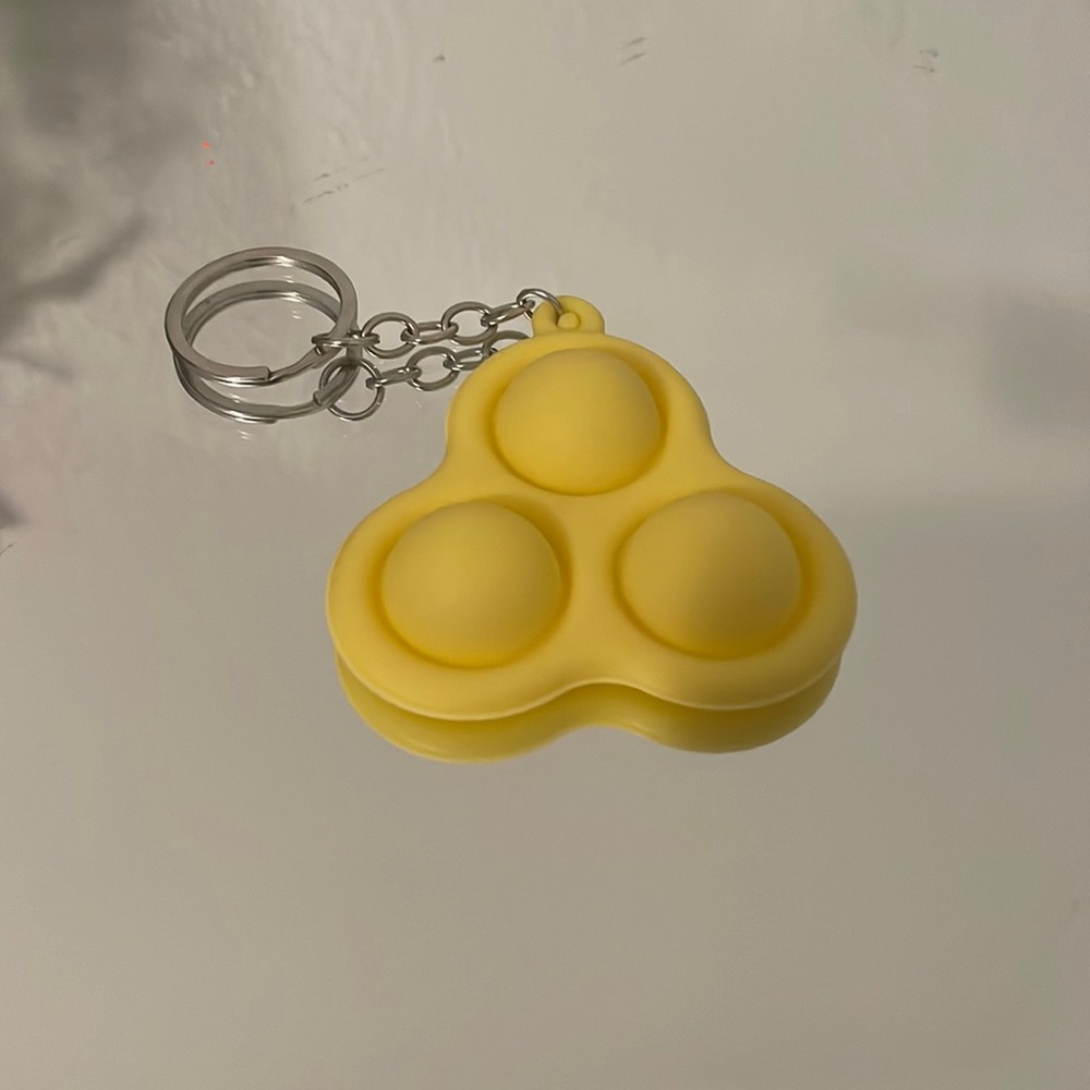 Yellow simple dimple pop it keychain